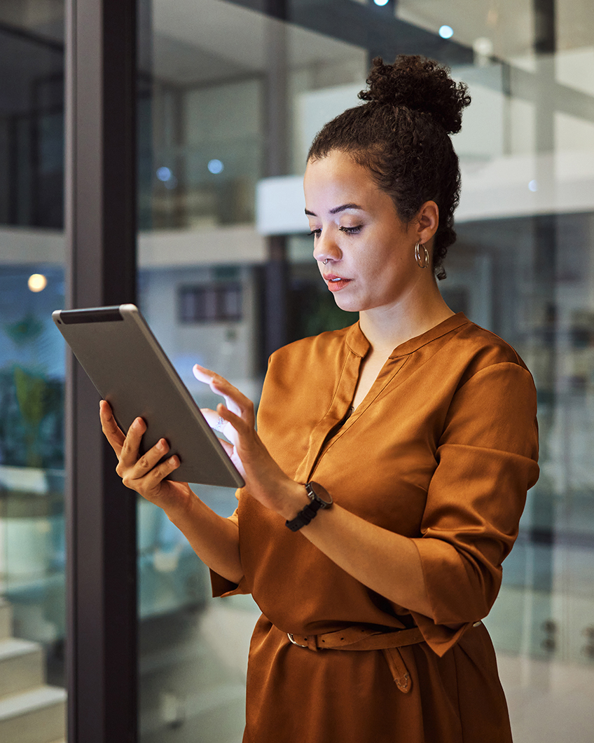 Association professional using a tablet to manage member services through a unified AMS platform